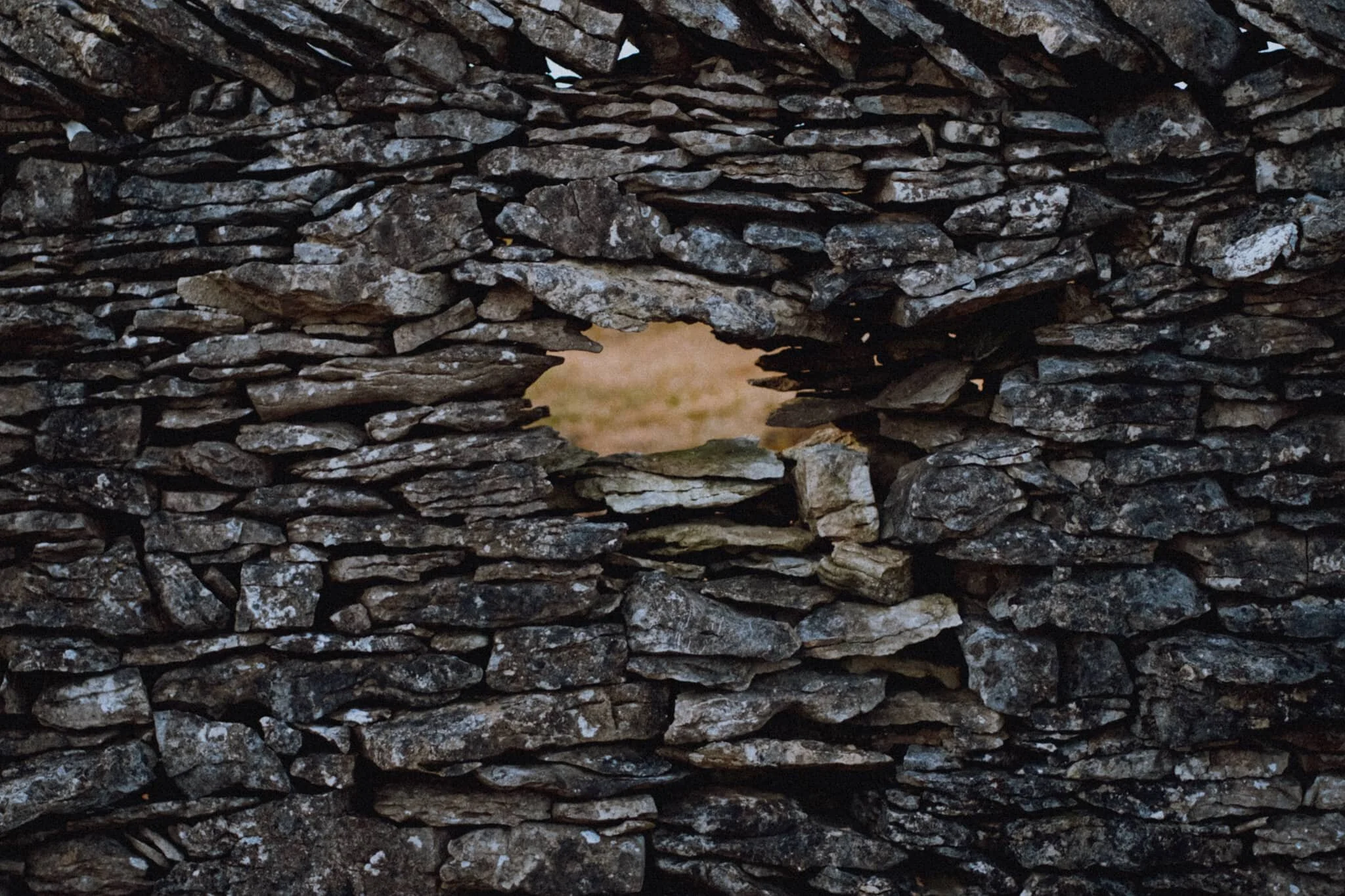 A beautifully constructed drystone wall with a small aperture that caught my eye.