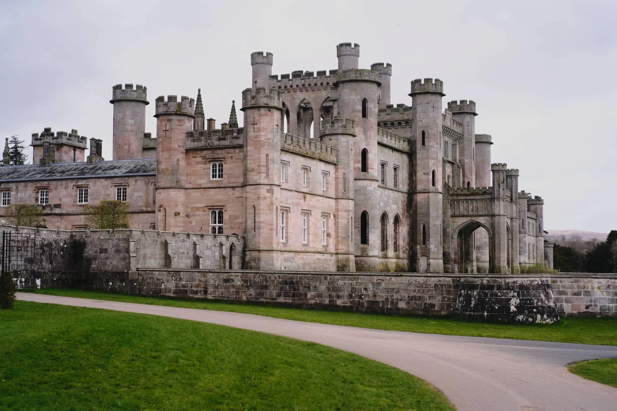 This is Lowther Castle. The roof has been removed and much of the stonework demolished, leaving the “shell” of the castle—technically a country house—intact with lots of plants and vegetation allowed to grow within.