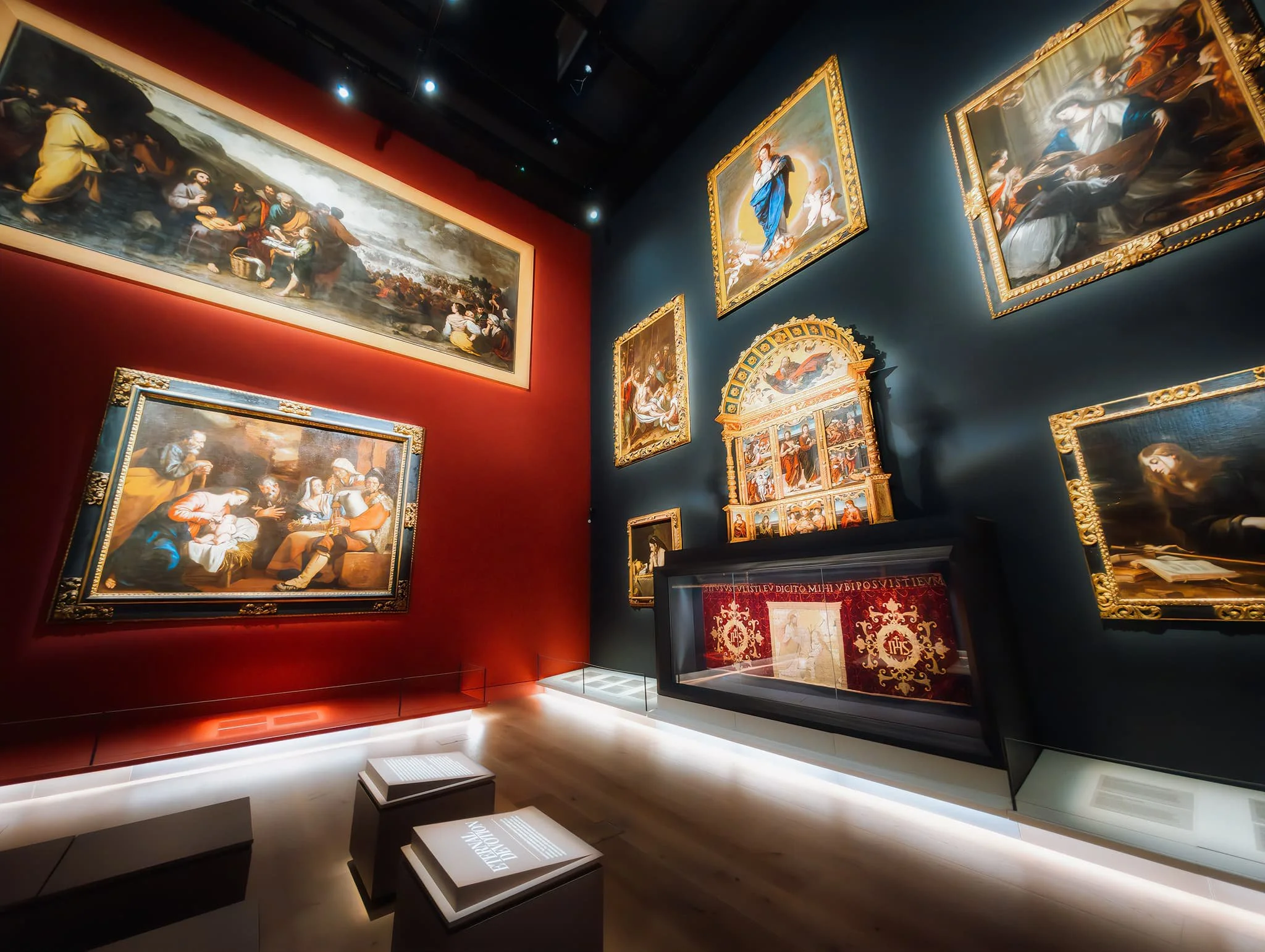 Within Gallery 1 on the ground floor this incredible room opens out, with paintings seemingly glowing against deep navy and ruby tones. This room explores the themes of