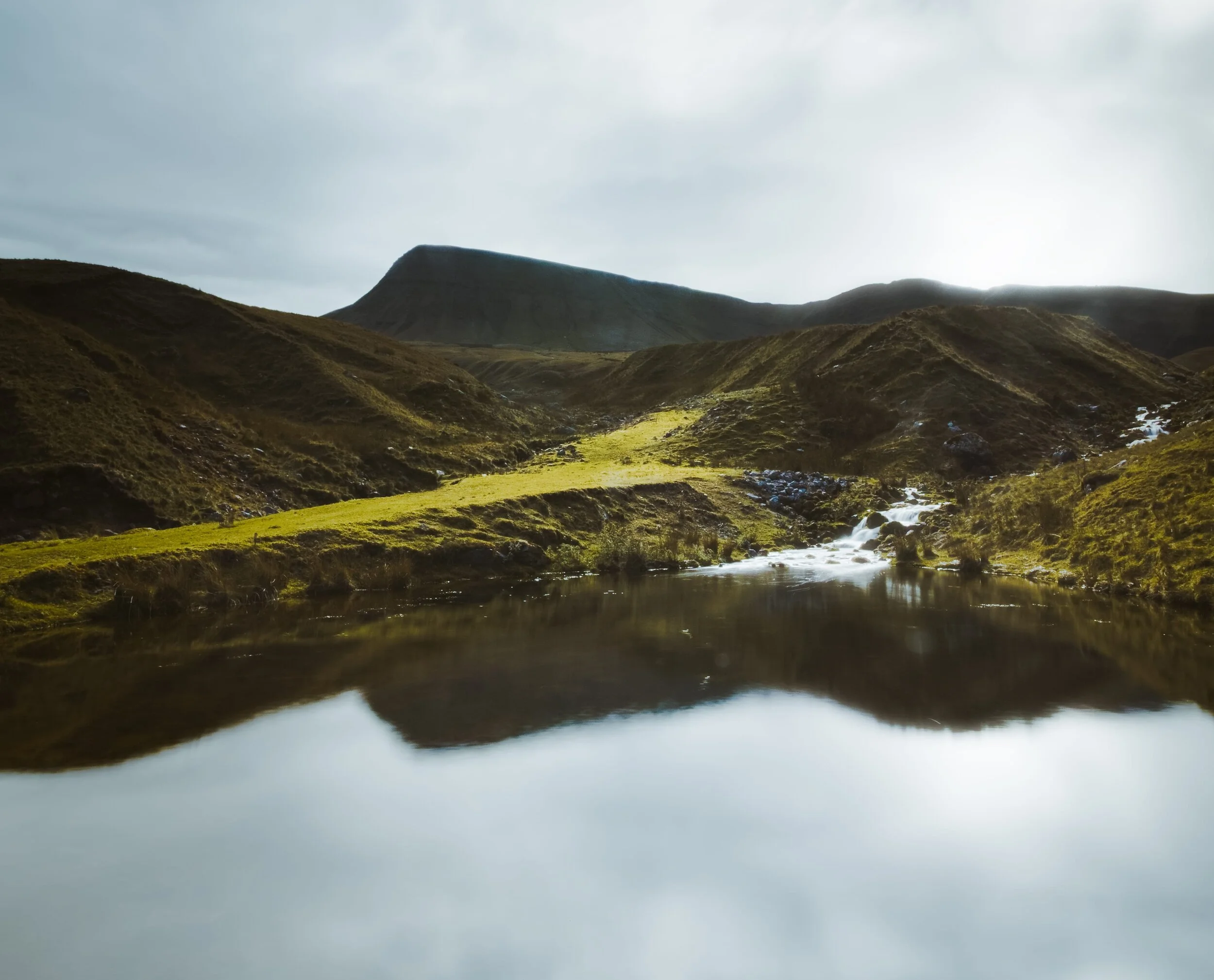 Heading back down from Llyn y Fan Fach, the various tributaries that run of the Carmarthen Fans stream together into this little pool, which I stopped by for a long exposure composition.