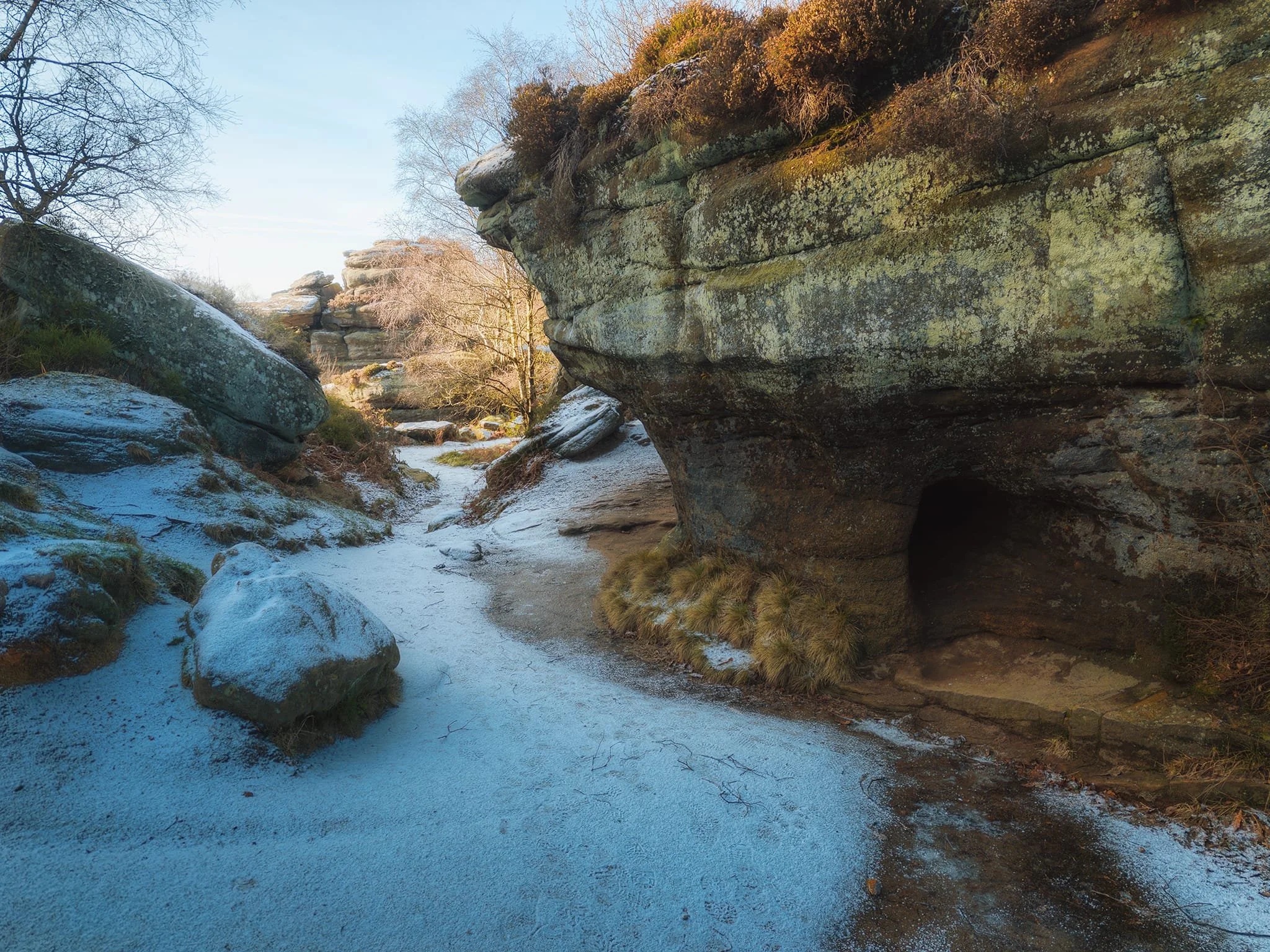Round the back of the Eagle, towards Lover’s Leap, a small valley retains the cold, freezing the beck. This is also where you can find this formation, with a natural tunnel cutting through it.