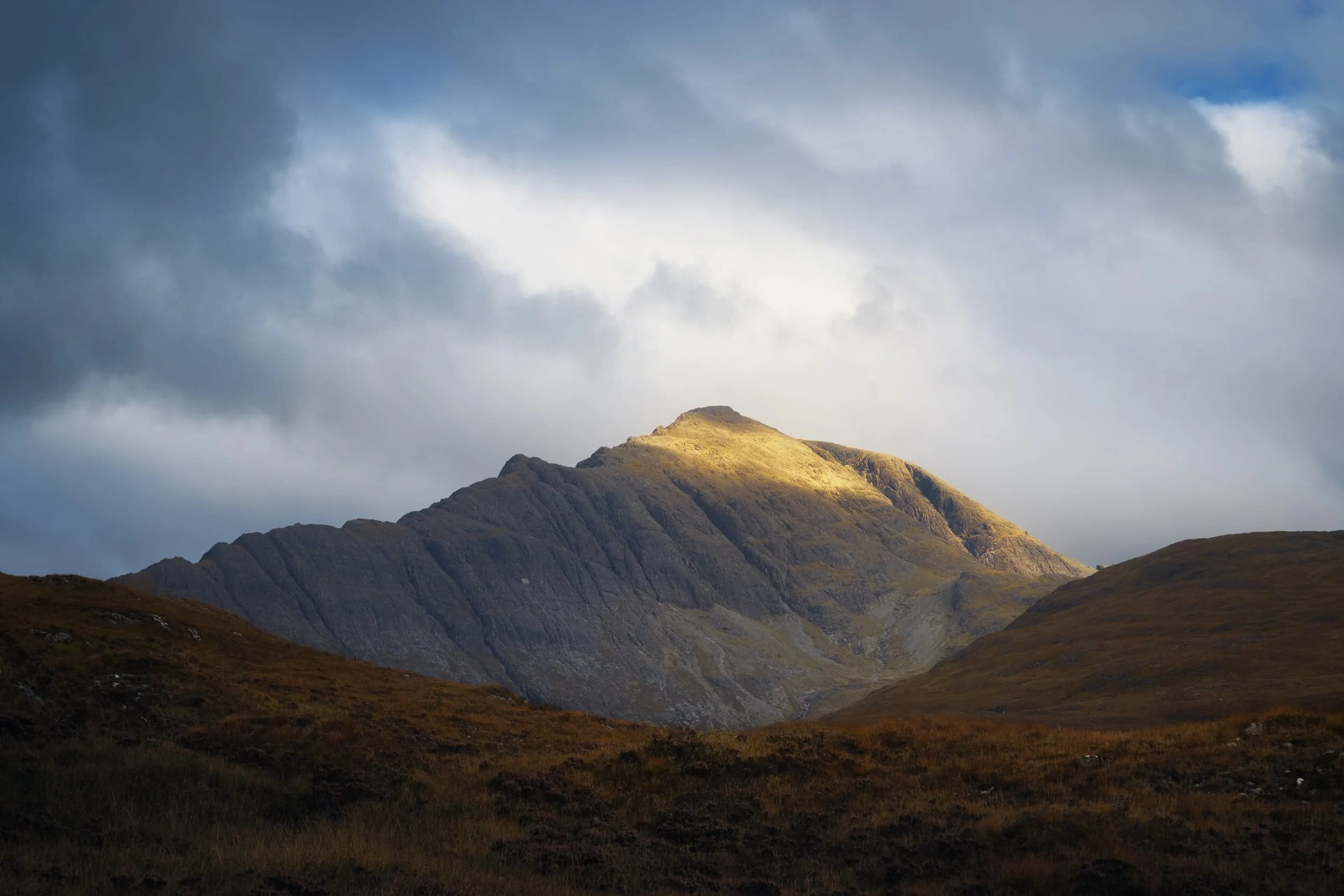 One of my favourite Skye mountains, Blà Bheinn , is more famously viewed from the shore of Loch Slapin. But from this hike the mountain’s fin-like southern ridge is more prominent, and I managed to snap this shot as the peak caught some morning light.