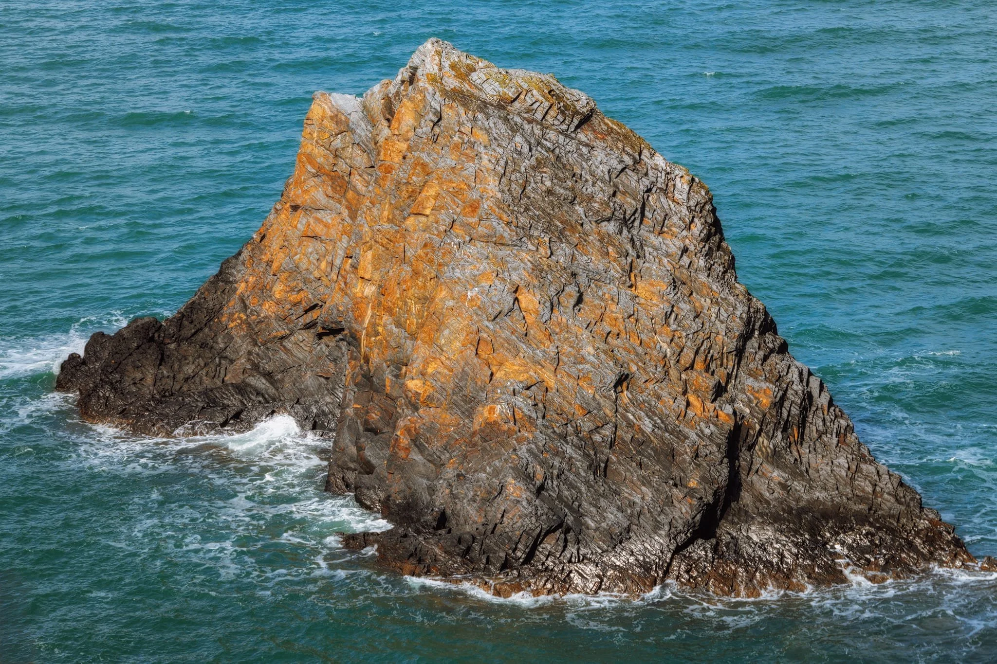 The smaller shark fin sea stack, part of Careg Wylan . I zoomed in tight to really feature it.