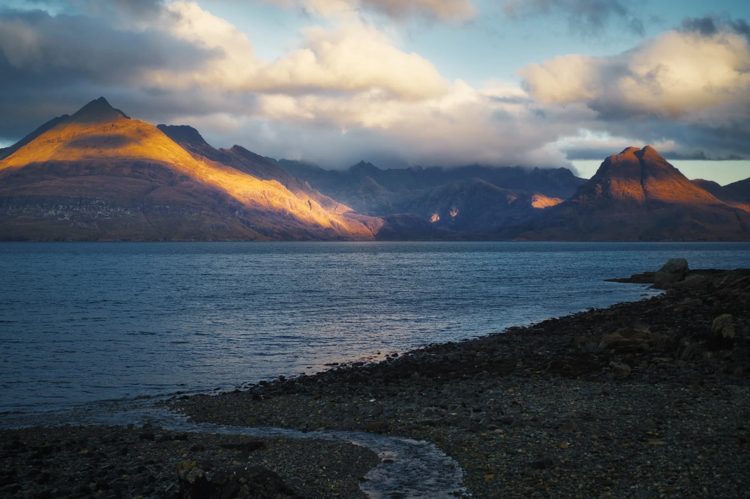 This is the view one is treated to as you arrive at the main car park near the shore of Elgol. It’s just ridiculously stunning. As the sun was rising behind us it cast slivers of golden light, which caressed the Black Cuillins in a dazzling display.