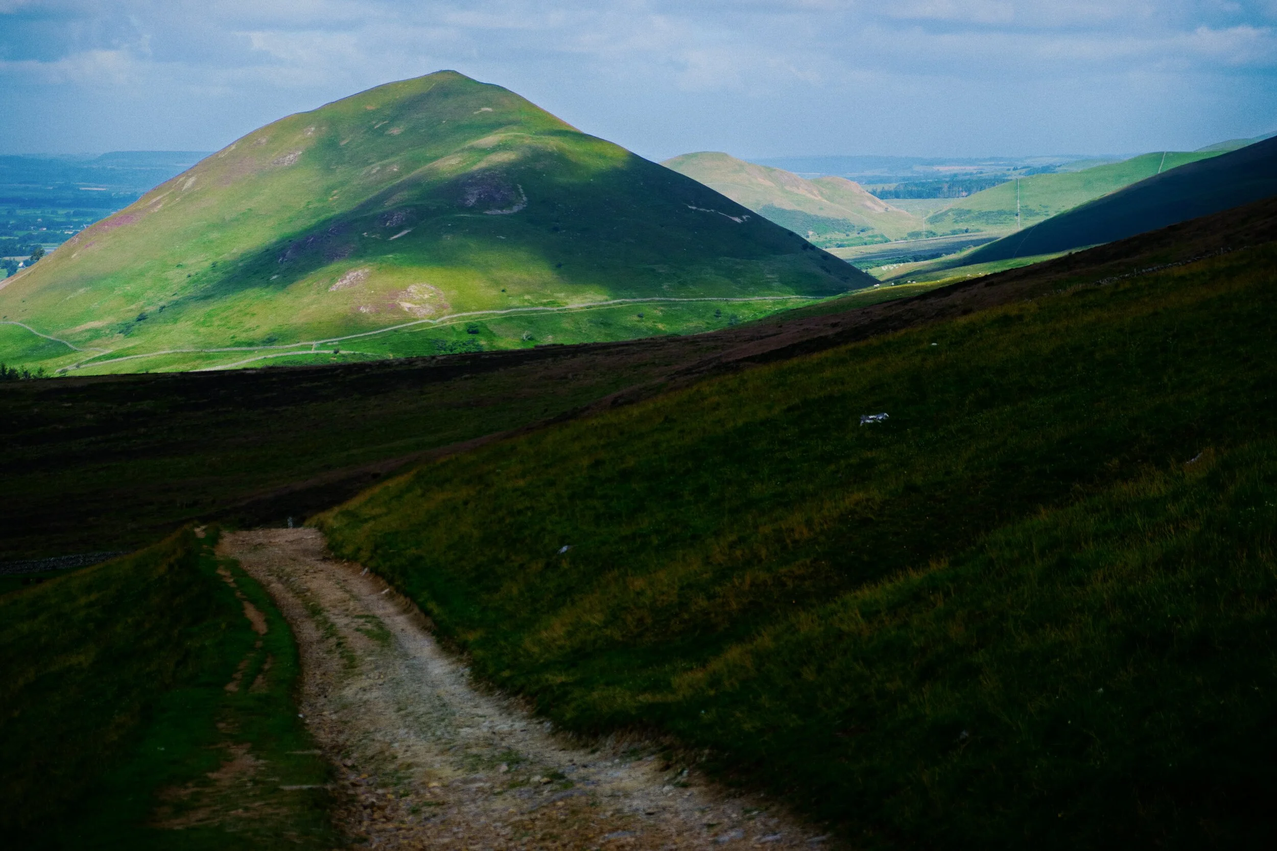 We’re gaining height. A break in the clouds illuminates Dufton Pike and Knock Pike (398 m/1,305 ft) beyond.