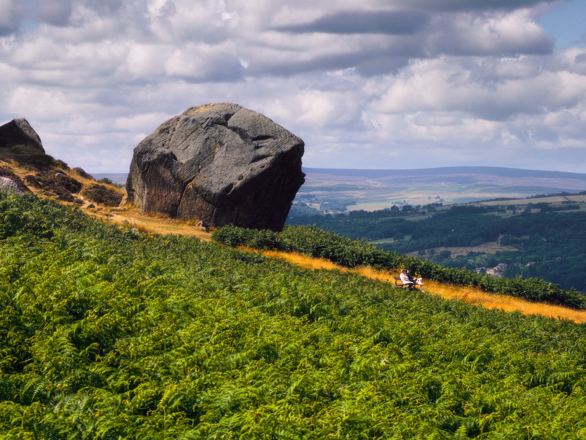 This frankly massive boulder, seemingly invading the privacy of the couple lower down the slope, is the “Calf” of the Cow and Calf. The Calf is said to weigh about 1,000 tonnes, separated from the Cow within the last 10,000 years.