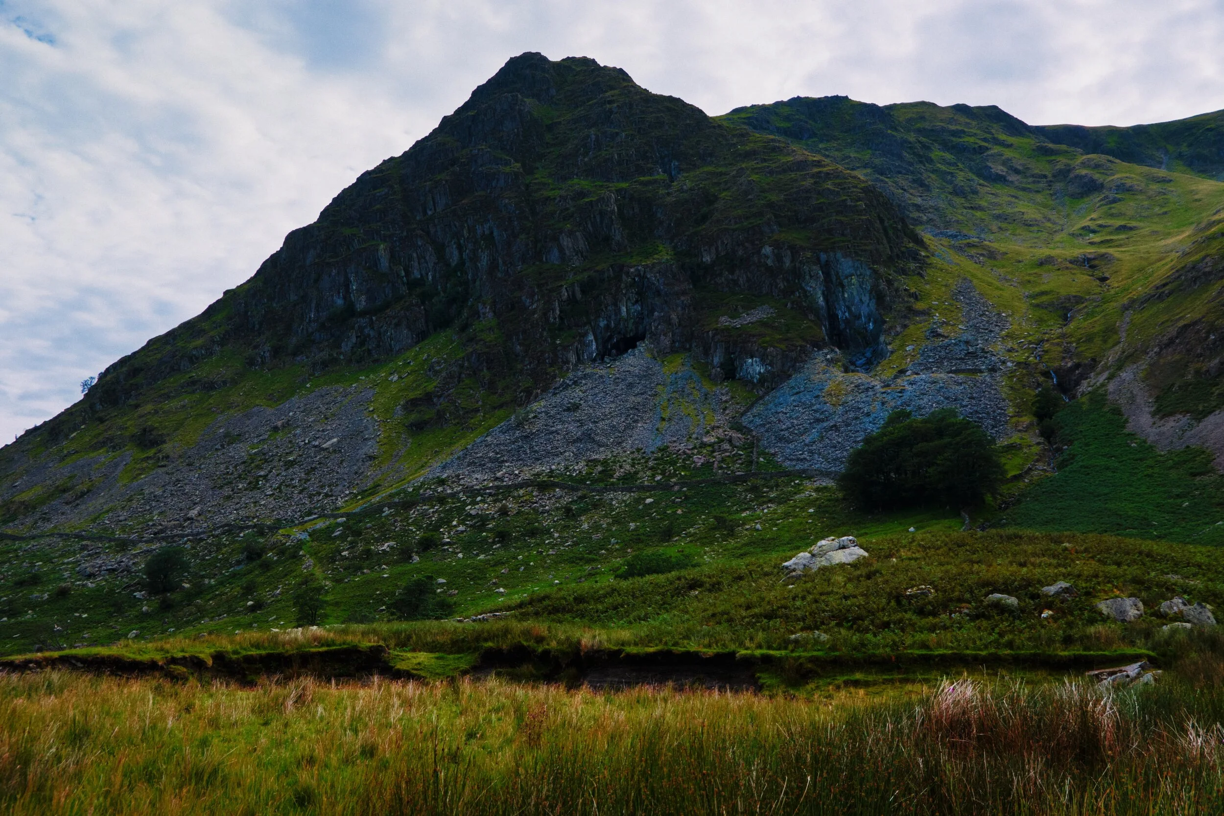 We start to enter the horseshoe of fells that surround Kentmere Reservoir. This is Rainsborrow Crag, with evidence aplenty of historical mining.