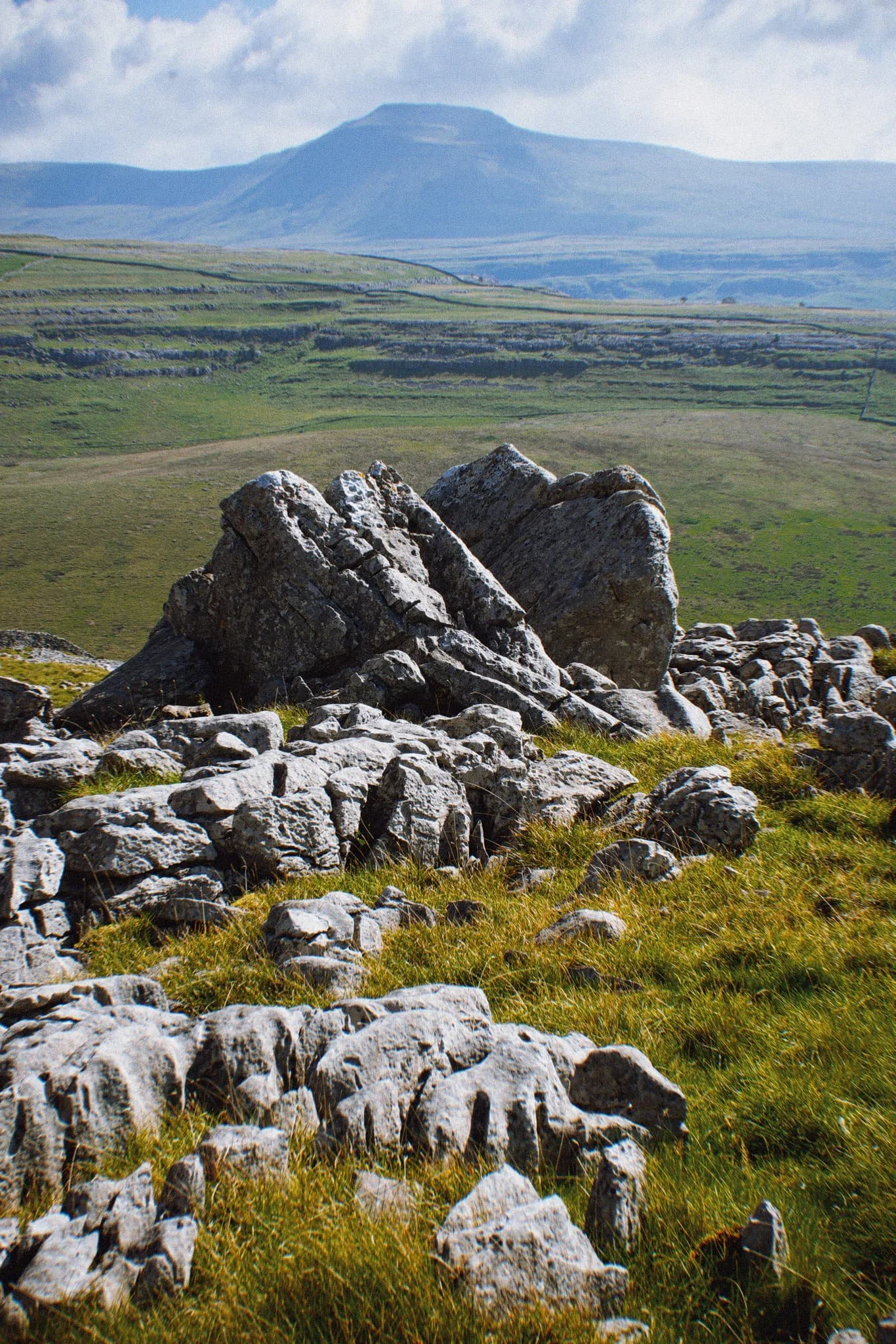 A large cluster of limestone boulders, no doubt dumped in position by the last Ice Age, provide a nice foreground focal point. They also, happily, seem to “point” towards Ingleborough.