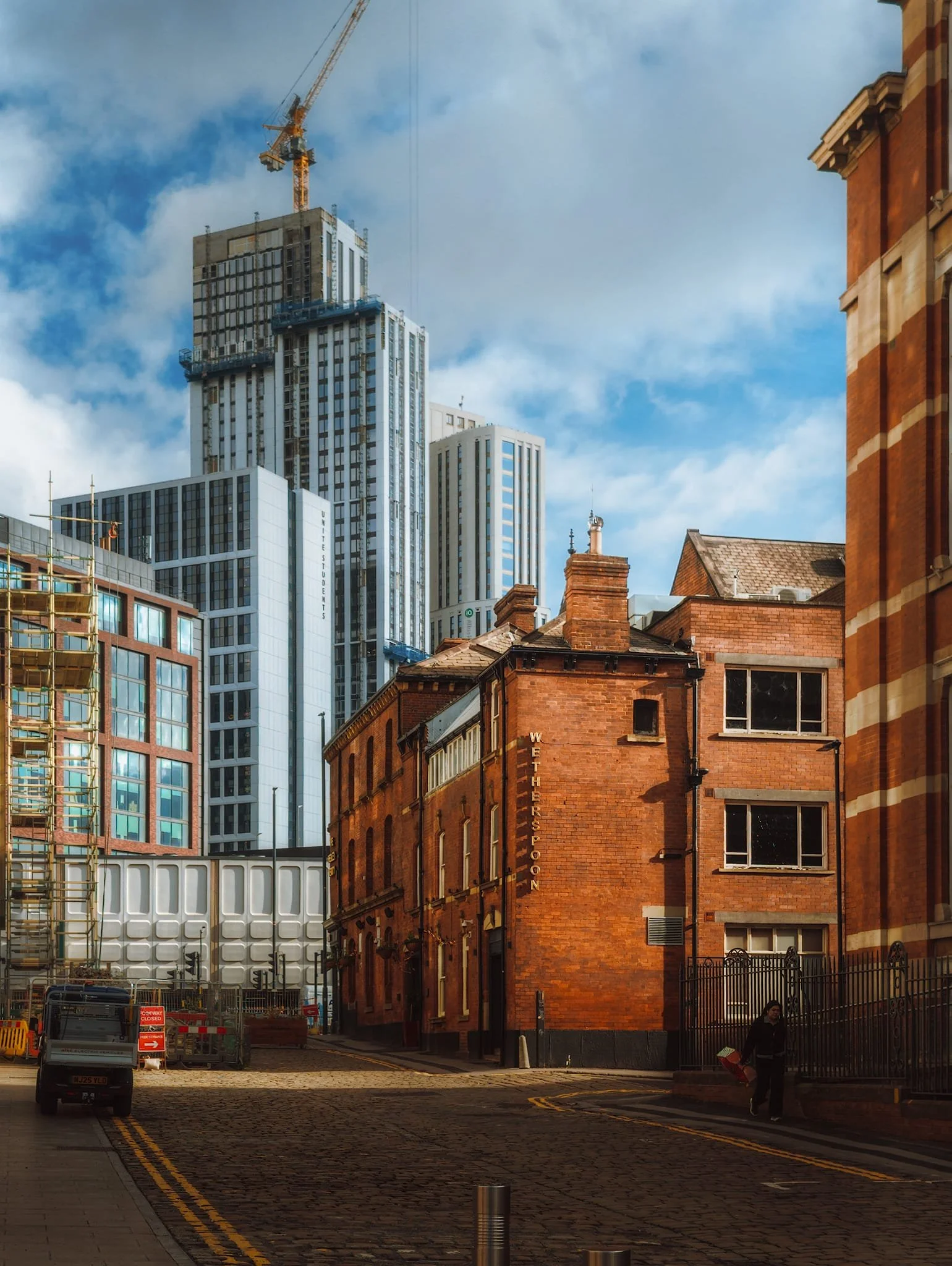 I enjoyed composing juxtapositions between old Leeds and new Leeds, such as this view down Vernon Street towards the old red-brick building pub, The Hedley Verity , with the to-be-completed United Students skyscraper.