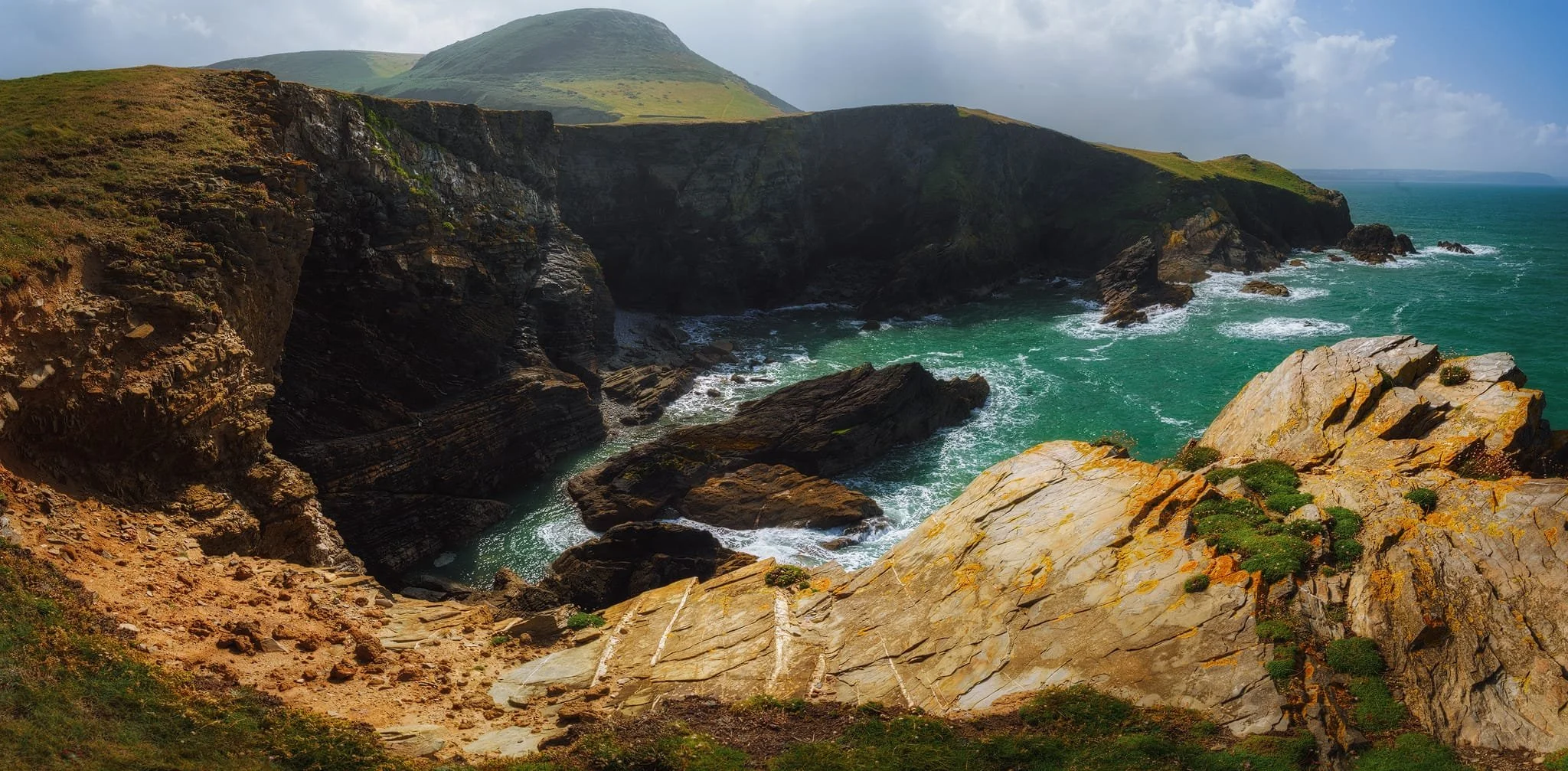 Looking back at Pendinaslochdyn and the cliffs from the northern tip of the peninsula. This is five vertical 14mm exposures, shot left to right, later stitched together into this massive panorama.