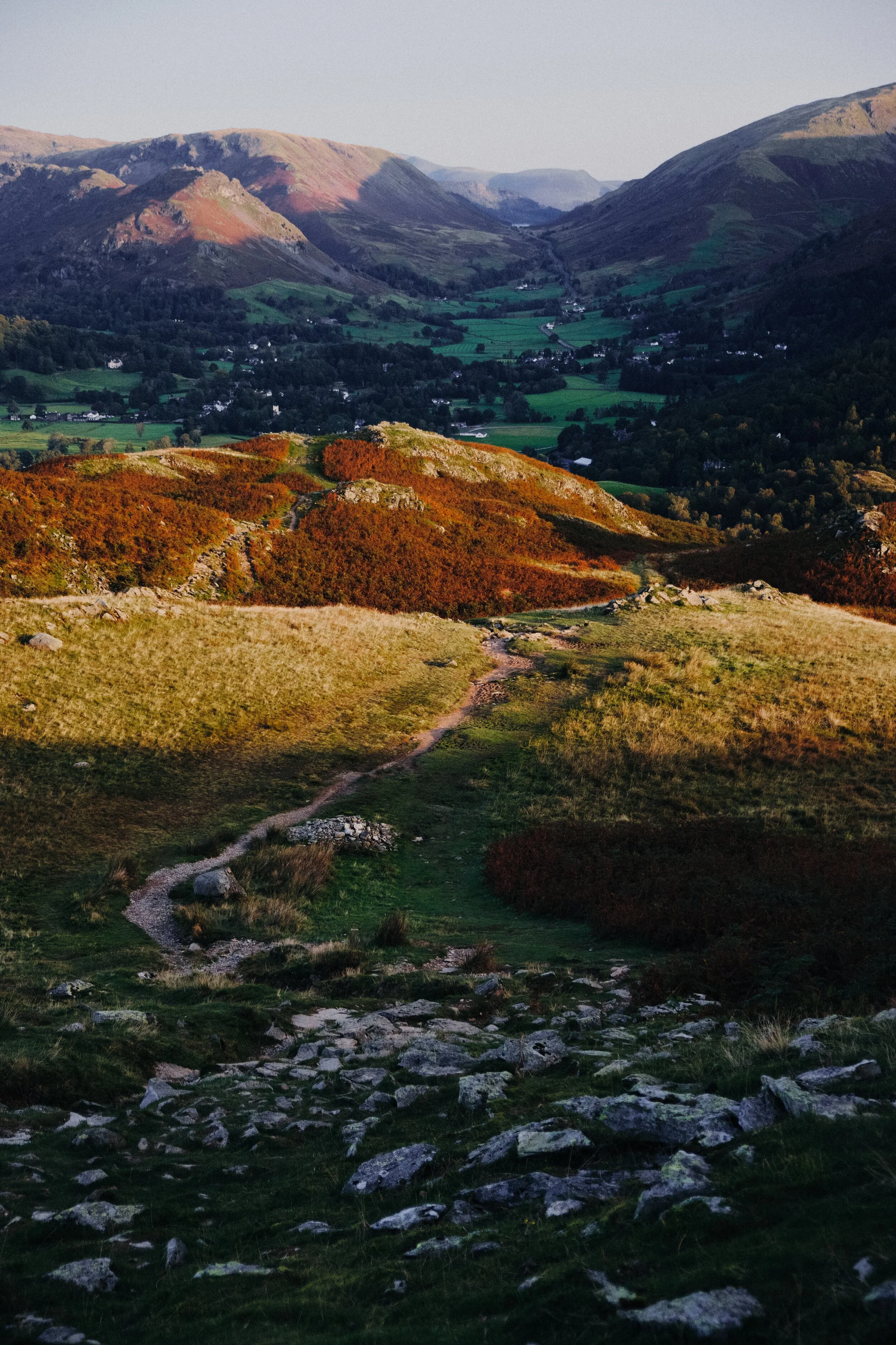 Looking back at the route up to the summit of Loughrigg. In the distance is Grasmere village and the fells north of it: Helm Crag, Steel Fell, and Seat Sandal.