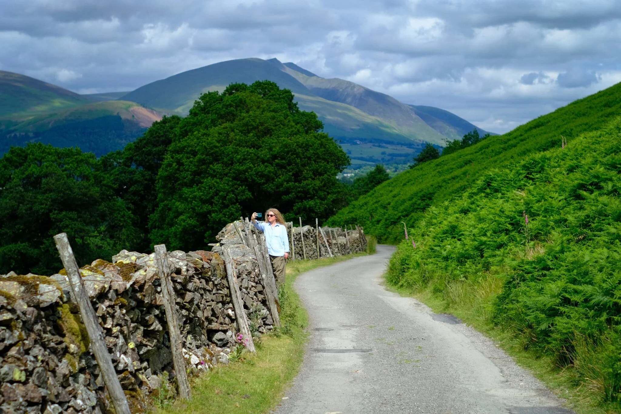 Back on the minor road underneath Catbells. Lisabet grabs a rare selfie, with Blencathra looking mighty in the distance.