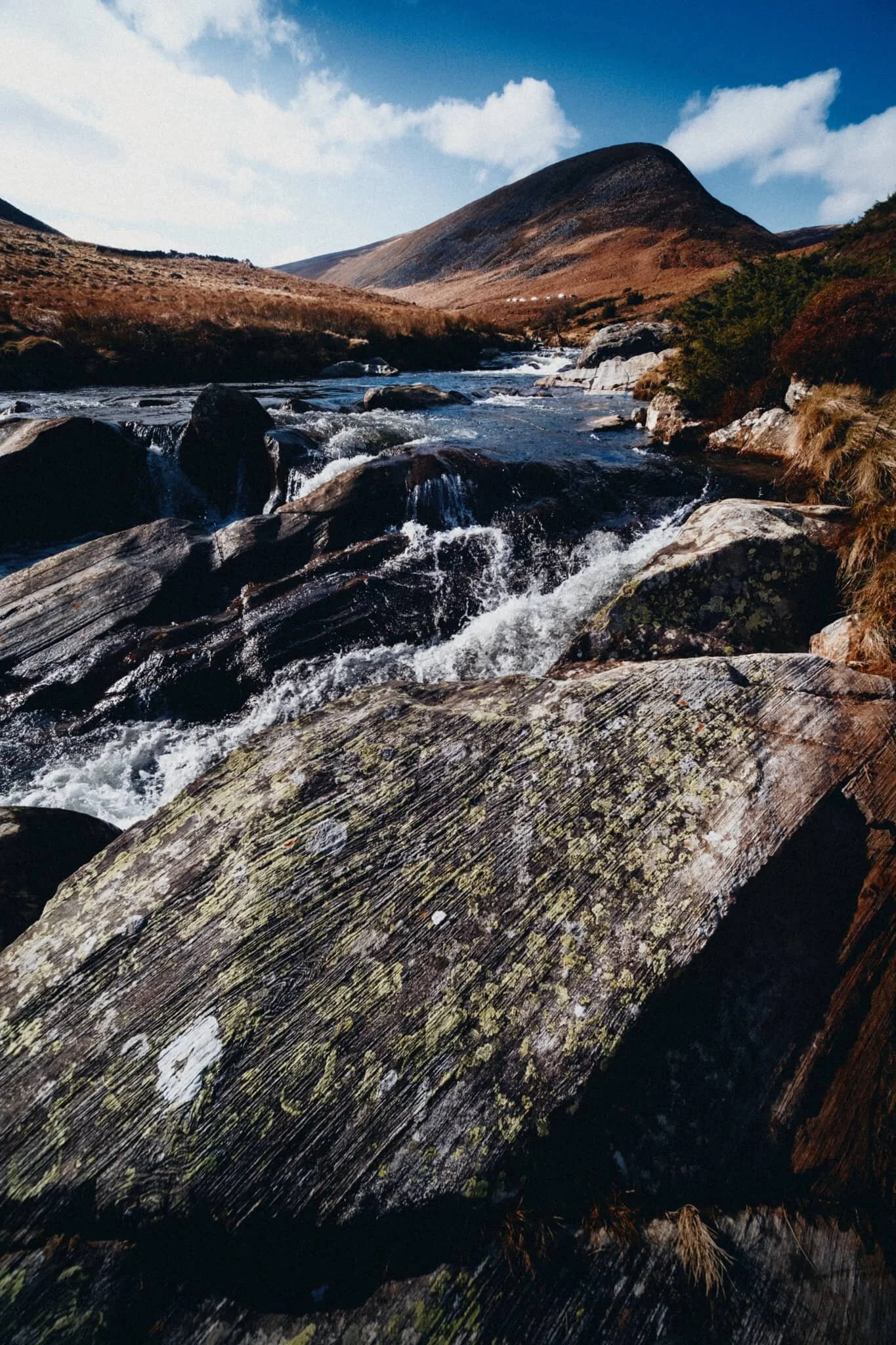 We found a particularly powerful section of the river as it gets forced between several large boulders. I went scrambling into the river to line up some compositions featuring Coomb Height, the river, and the textures of these gorgeous boulders.