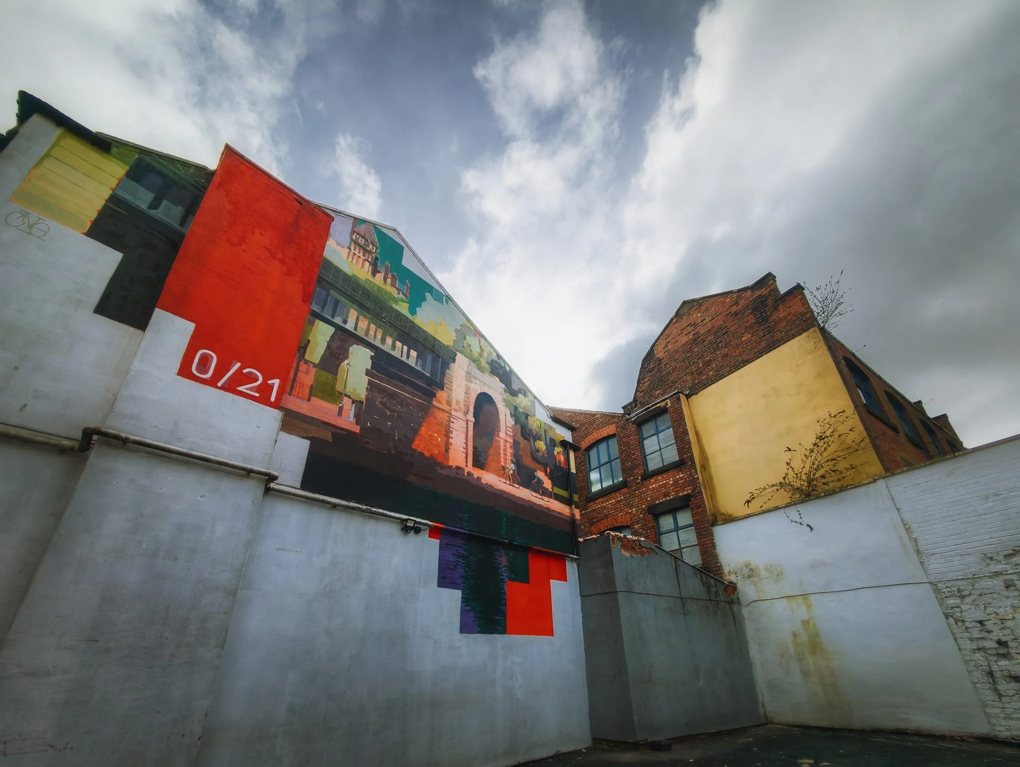 The next mural, found behind the Slug & Lettuce . The piece is called Mile 0/21 by Gavin Renshaw . It depicts the official start and end of the Guild Wheel walk, created in 2012 as part of the Preston Guild celebration.
