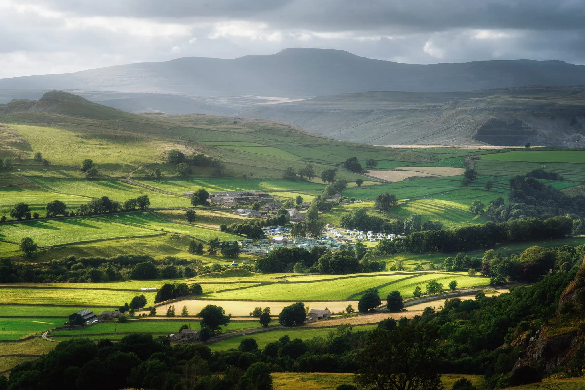 We located Henside Lane, which takes you rather steeply back down to Ribblesdale and Langcliffe. In the far distance I noticed the light illuminated Stainforth village nestled in the valley, with dark Ingleborough looming above. I zoomed in all the way to 240mm for this wonderful scene.