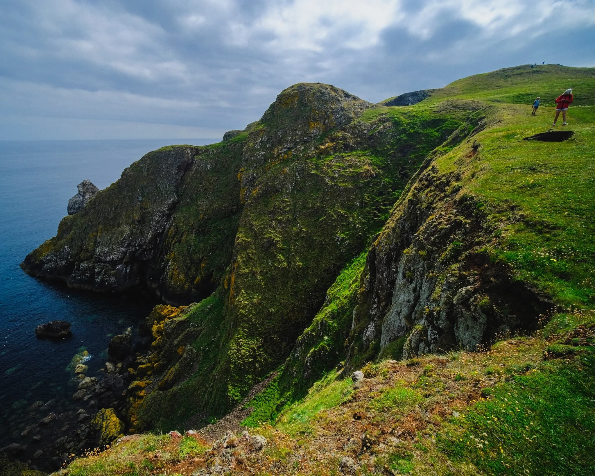 Other hikers follow the cliff edge trail, and as I line up a composition of the cliffs of St. Abb’s Head, I deliberately include the people to help provide a sense of scale.