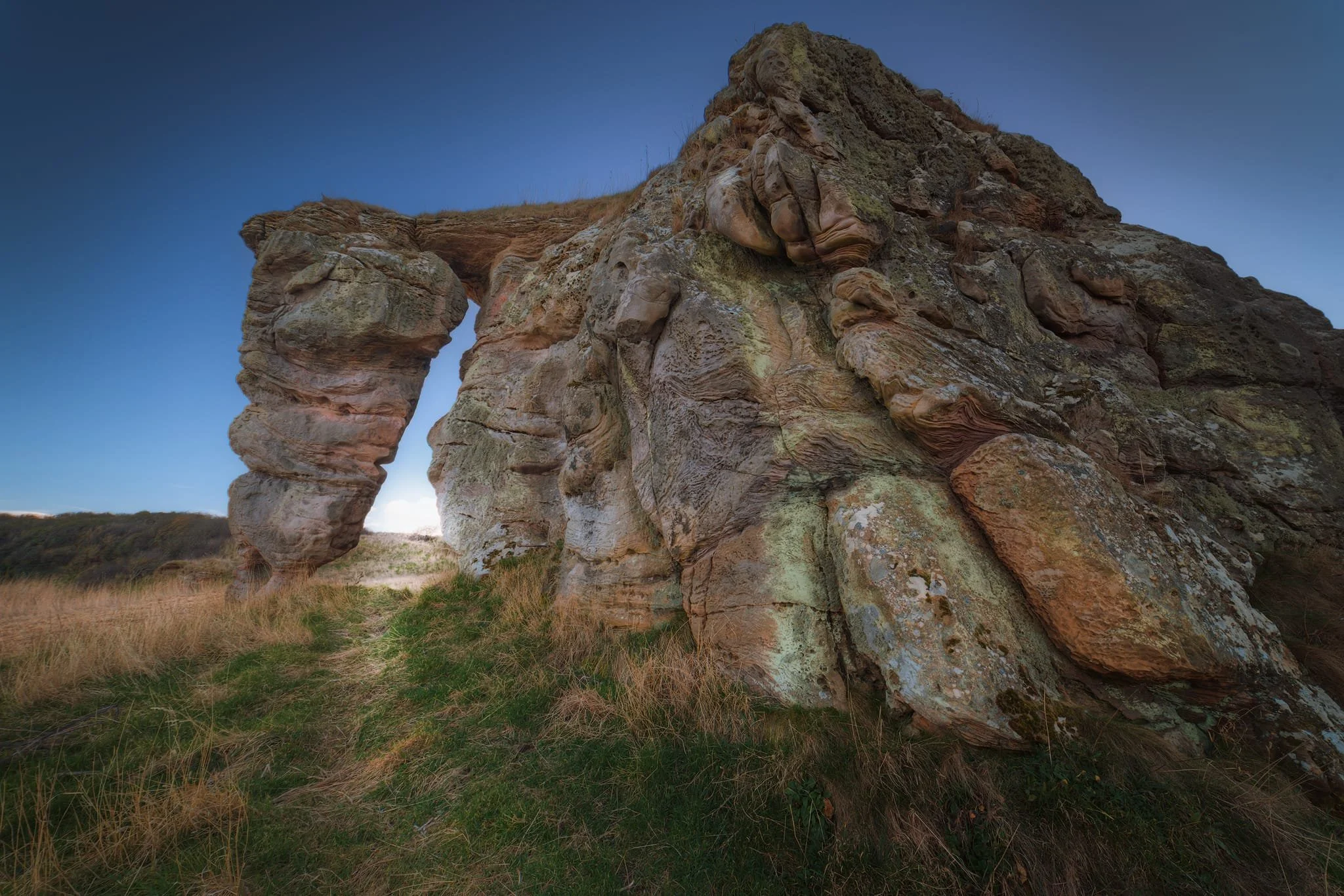 Buddo Rock viewed from the sea. The name may well seem unusual. It seems to be linked to a local surname, first recorded in 1568. A Thomas Buddo is recorded in St Andrews around 1590, and there was an Effam Buddo in nearby Brownhills.