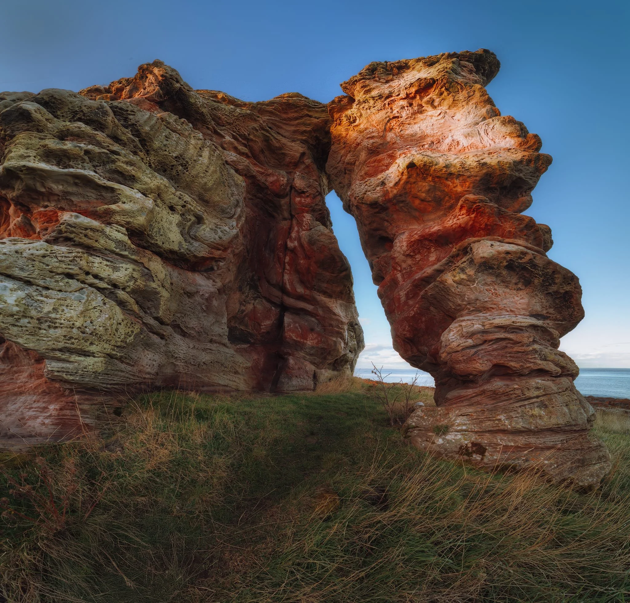 This is Buddo Rock. It’s a stack of pink sandstone that was once part of the cliffs along the coast; a remnant of a former sea cliff that formed around 15,000 years ago. The formation is a good 15 m (50 ft) tall, so even with my 14mm ultra-wide lens attached I still couldn’t get the whole thing in. This was image was achieved by shooting seven landscape shots, stacked top to bottom, for a massive vertorama.