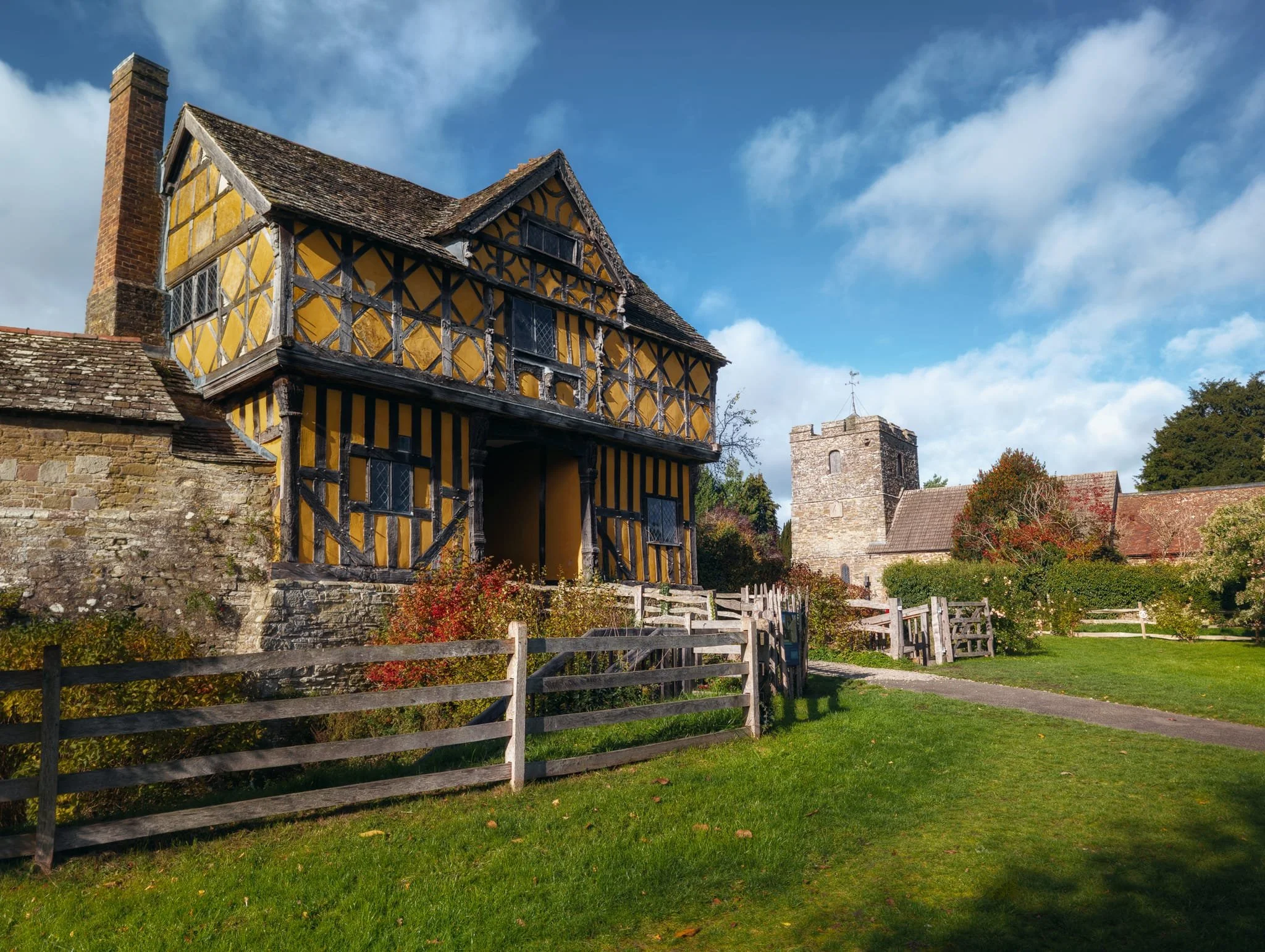 The beautiful gatehouse getting some nice sidelight, with the humble church in the background.