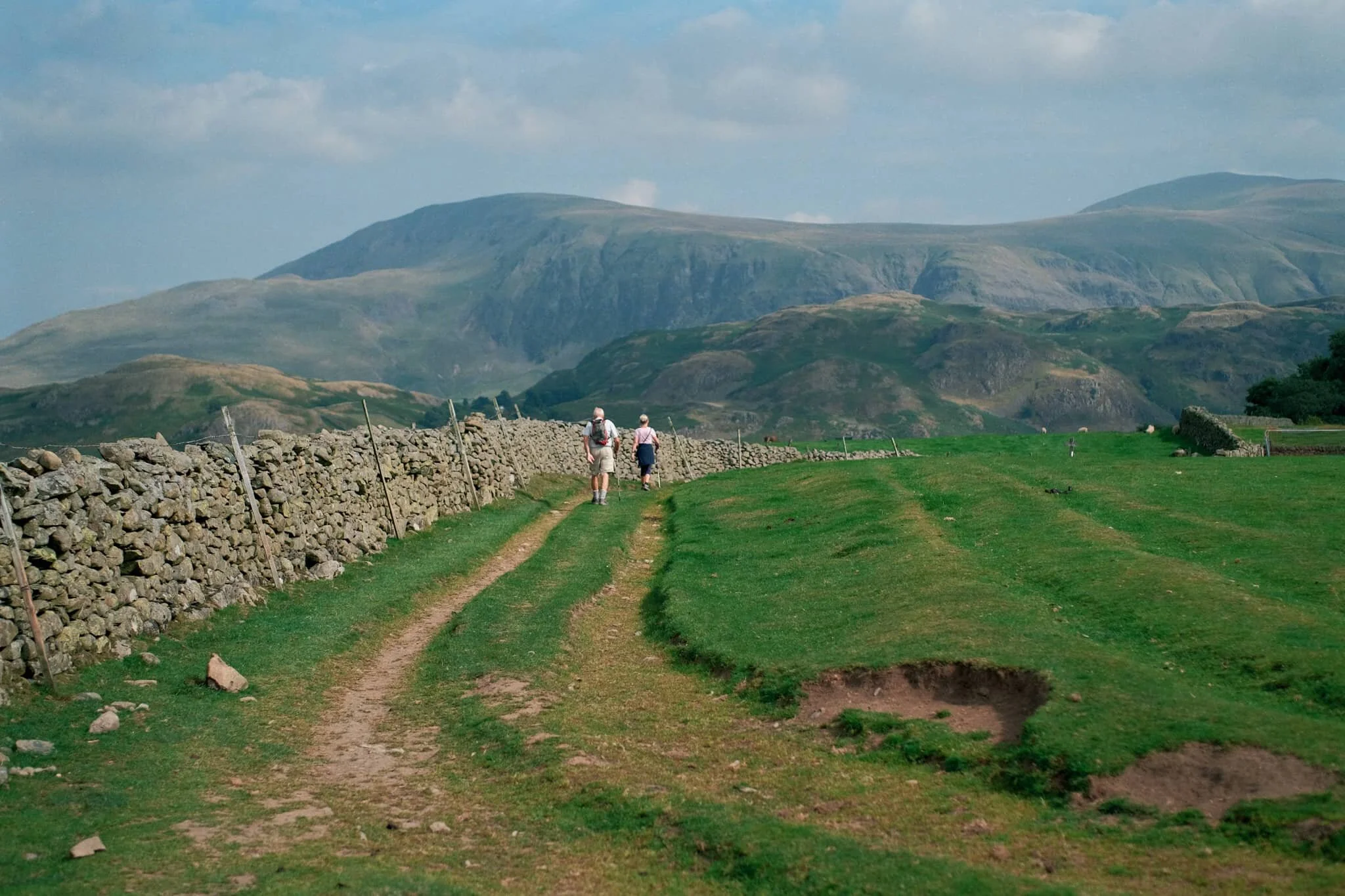 Follow other hikers along the trail back down to the car. The haze appears to lift somewhat around the Helvellyn fells.