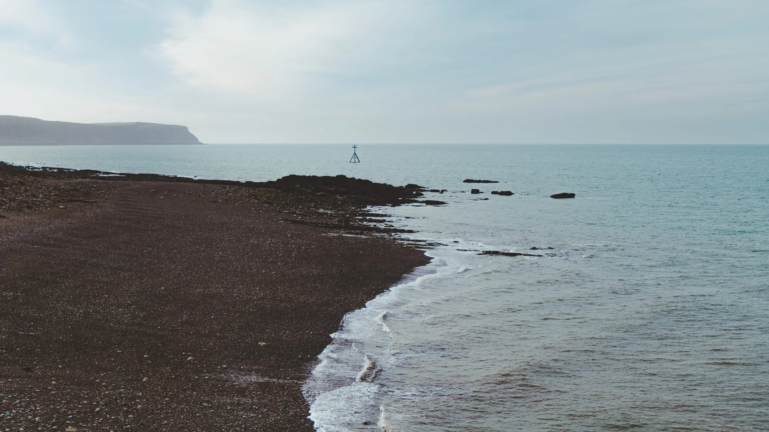 Looking south from the West Pier of Whitehaven towards St. Bees Head in the distance. Not a lot going on in this photo, and it was the simple arrangement of all the elements that inspired me to shoot it.