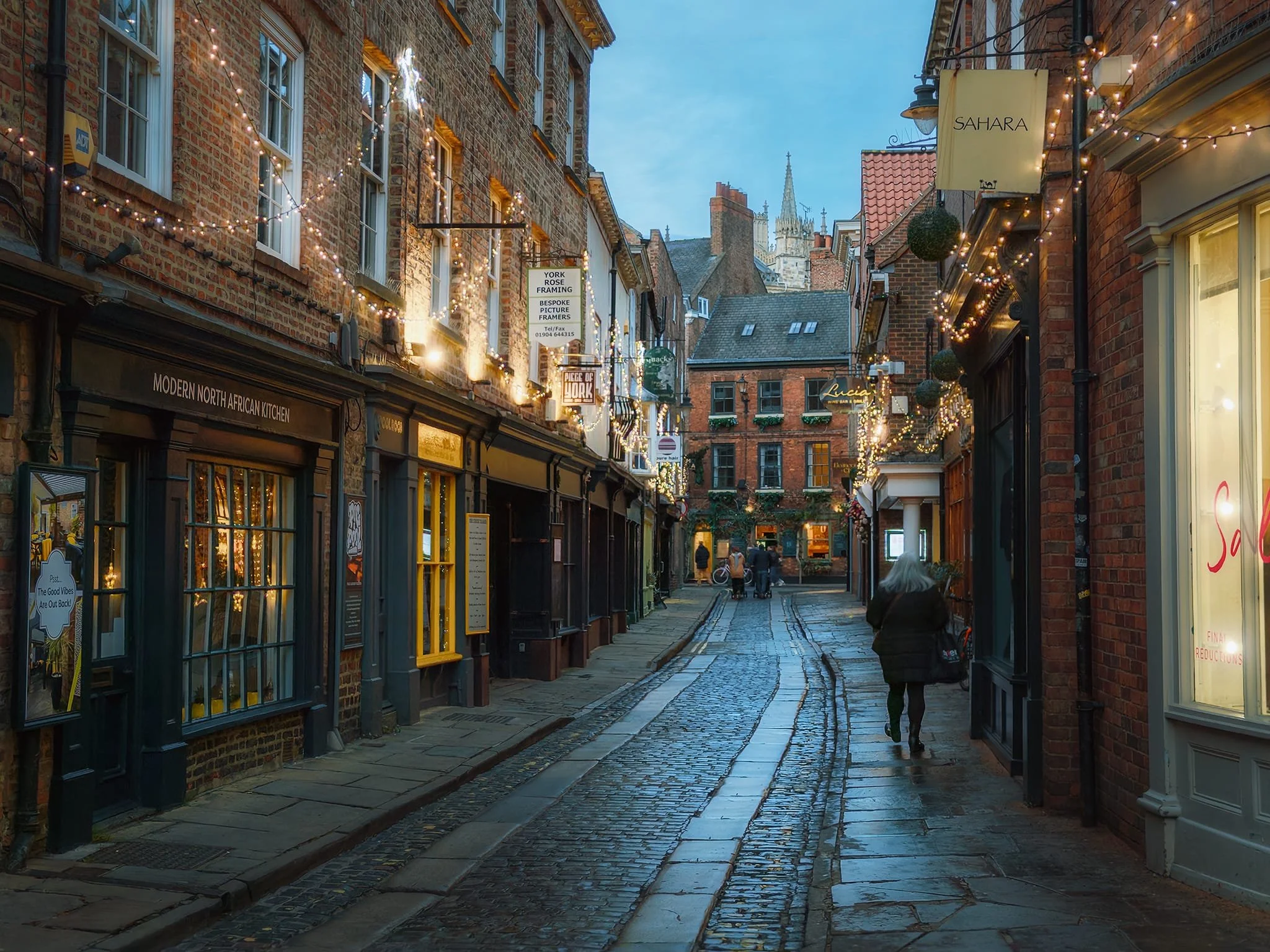 Grape Lane, as the sun set. This street is situated within the city walls of the Roman Eboracum . It was originally named “Grapcunt Lane”, a reference (like other similarly named streets in the UK) to prostitution in the street.
